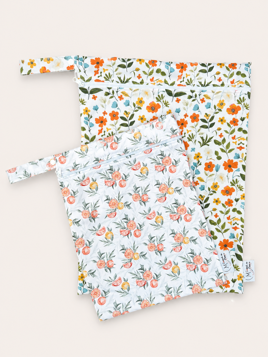 Wetbags fleurs/agrumes à rabais